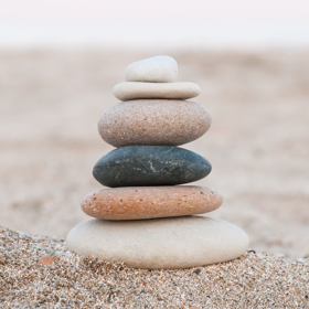 stack of smooth stones on beach