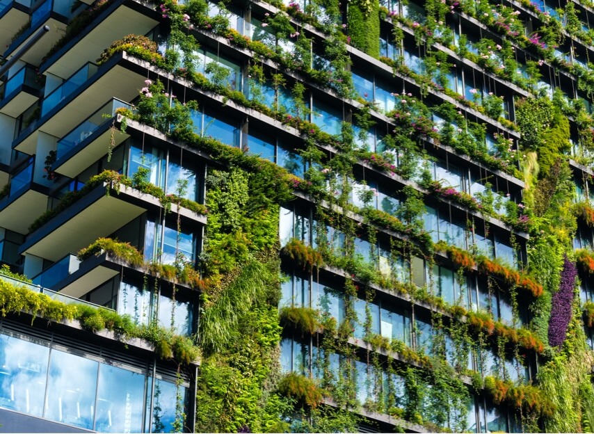 A modern building covered in plants