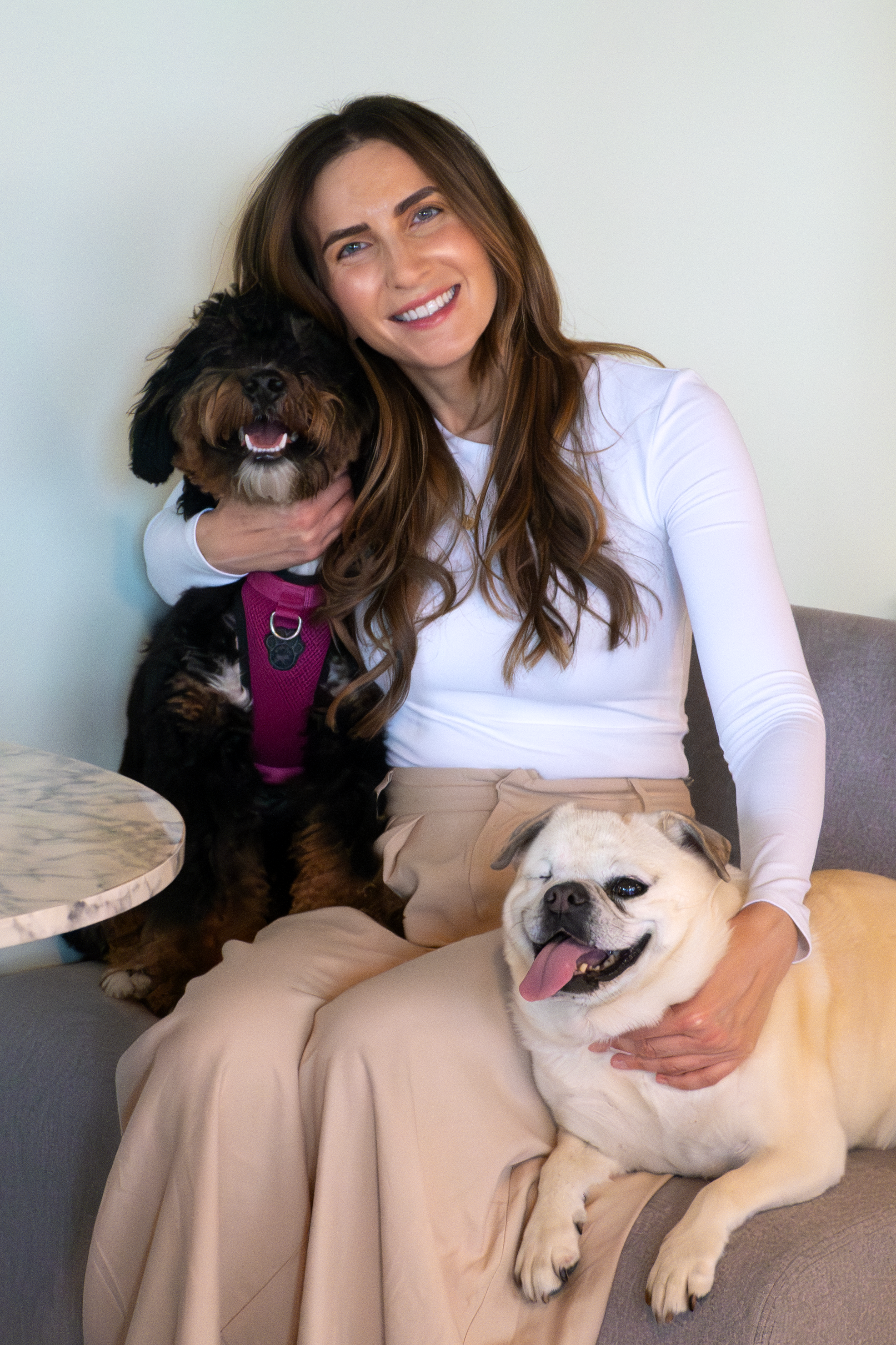 Jacqueline Prehogan snuggling with her two dogs