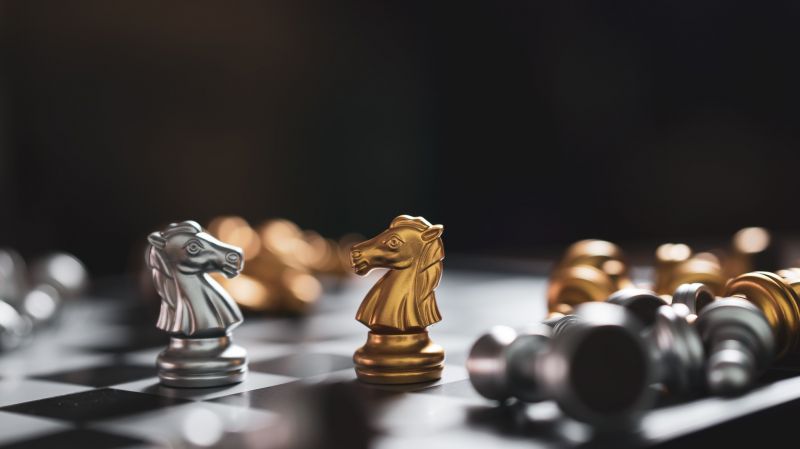 Chess game with golden and silver figurines figures