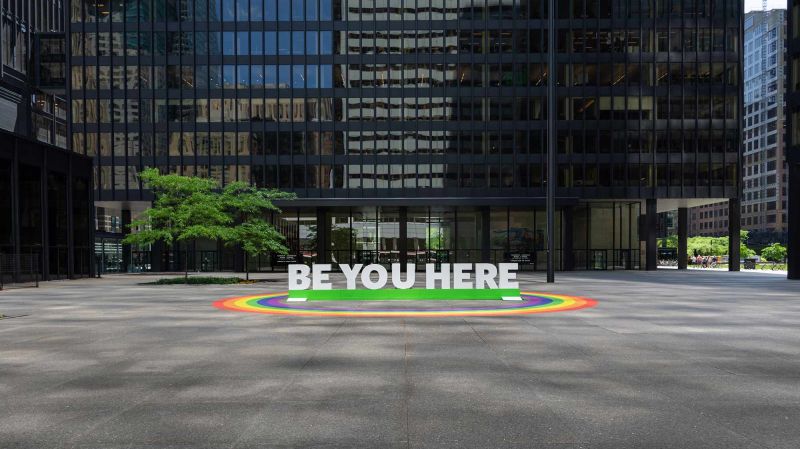 BE YOU HERE art installation with LGBTQ rainbow flag in Toronto during Pride Month.