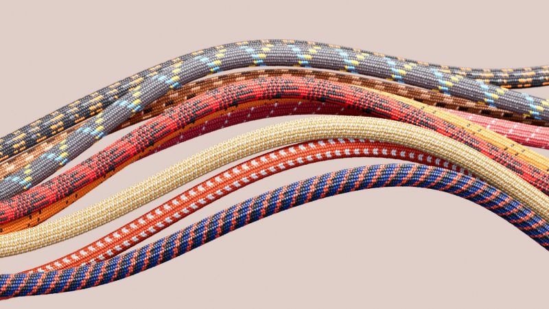 Different coloured ropes/paracords moving in the same direction. Decision-making concept.