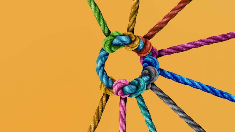 Colourful ropes connected together as a symbol of cooperation and collaboration.