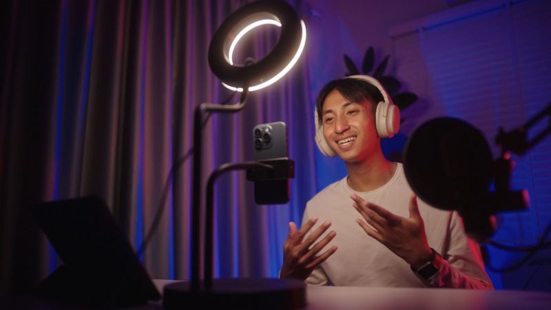 Young Asian male influencer speaking to camera