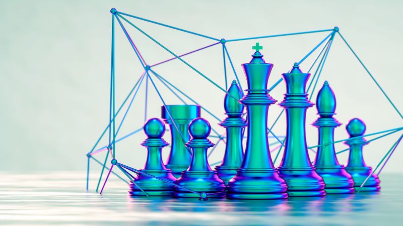 Teal metallic chess pieces in a digital lattice