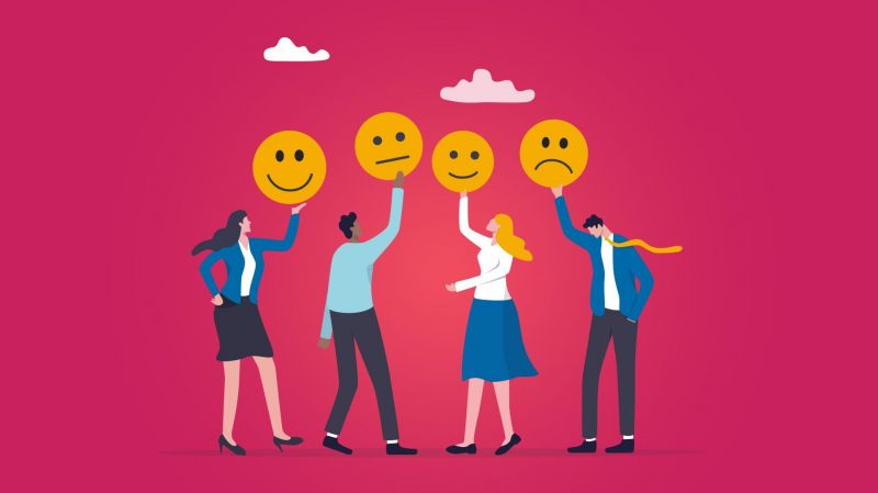 Four people figures holding emojis with different emotions on a pink background