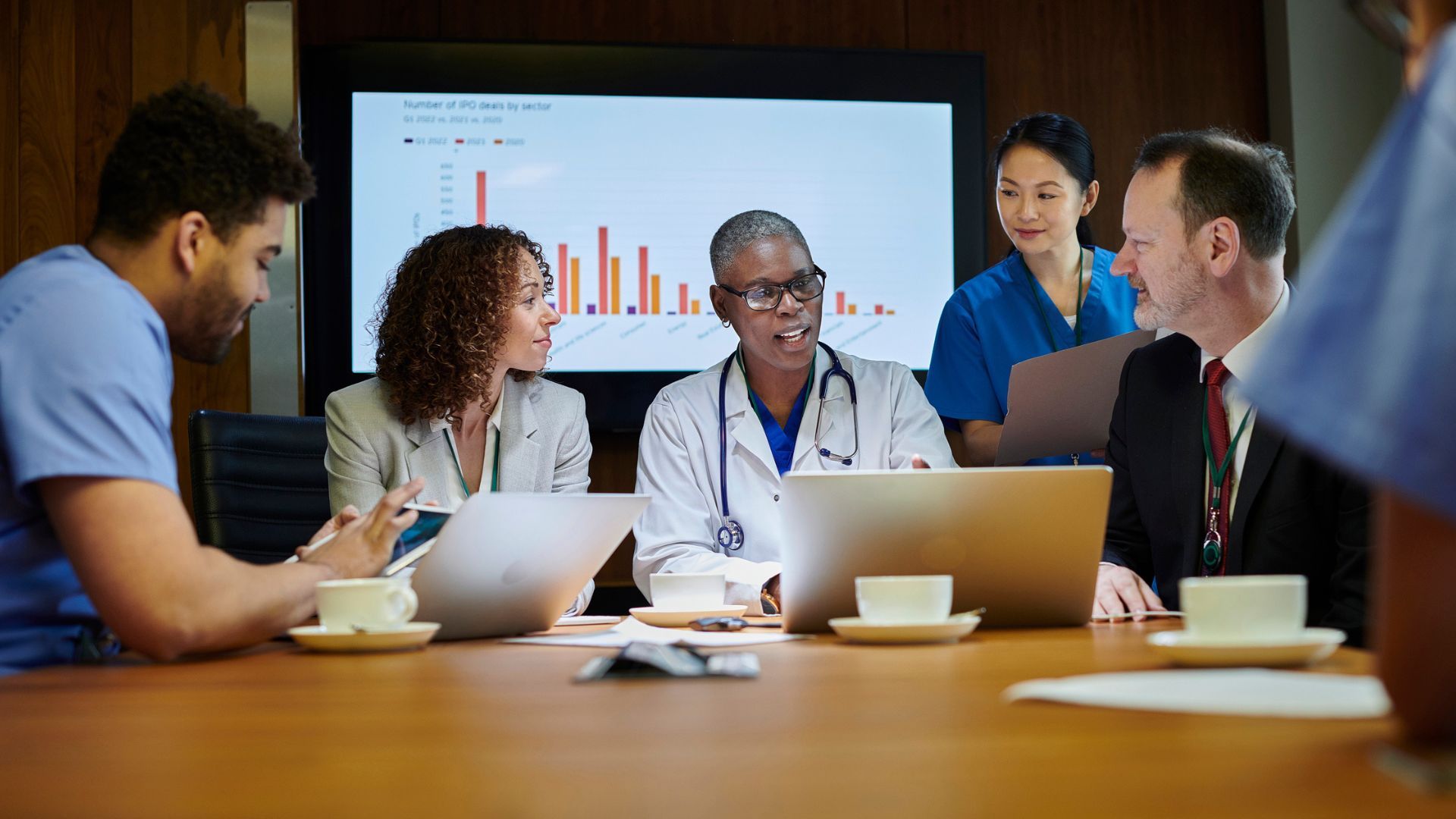 Meeting between consultants and health-care organization client.