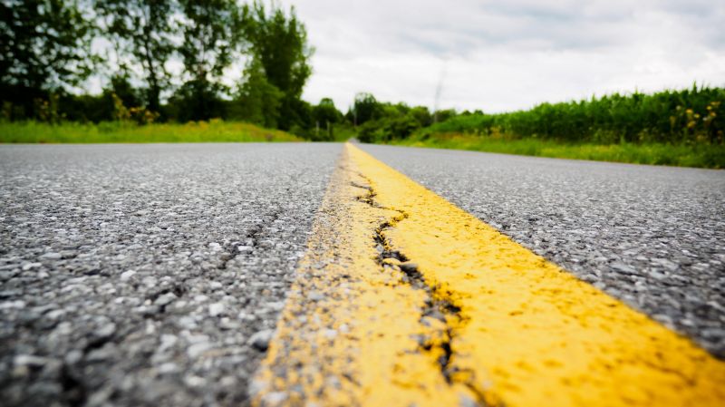 A road with a yellow line