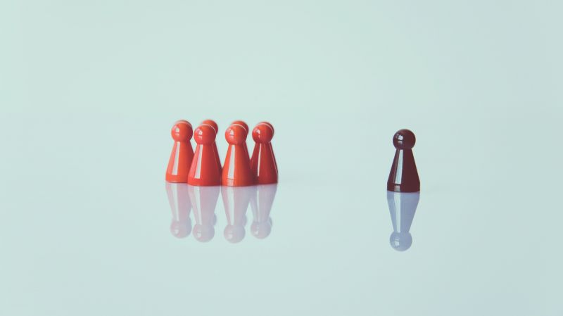 Checkers figures representing the group and the leader, blue background