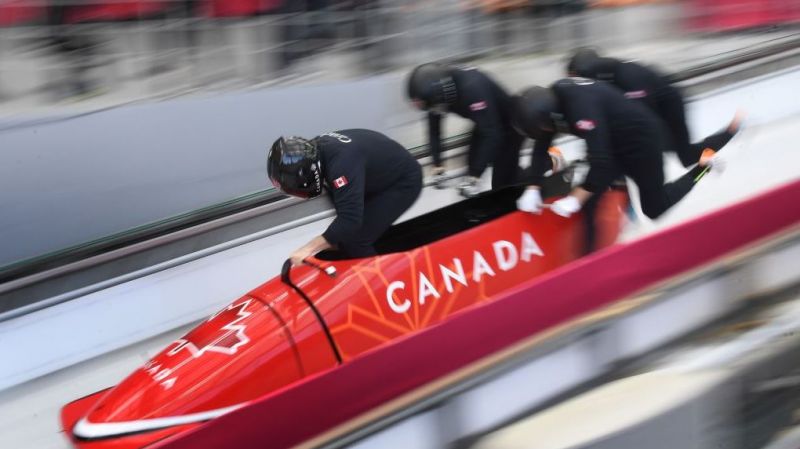 Pilot Justin Kripps of Canada (front) leads his team as they start the 4-man bobsleigh training session during the Pyeongchang 2018 Winter Olympic Games.