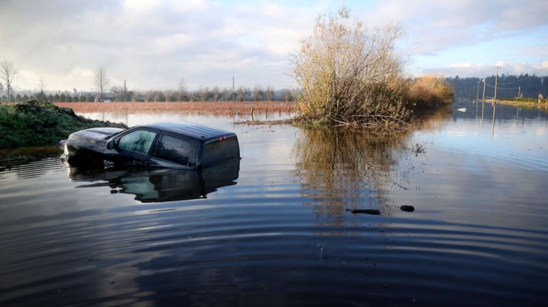 samA truck sits submerged in floodwaters on November 19, 2021 in Abbotsford, British Columbia.ple