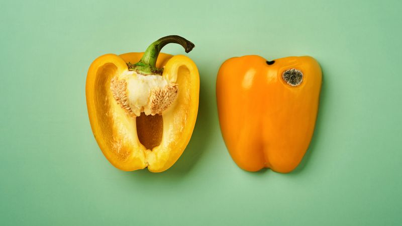 Yellow pepper of a green backgwound