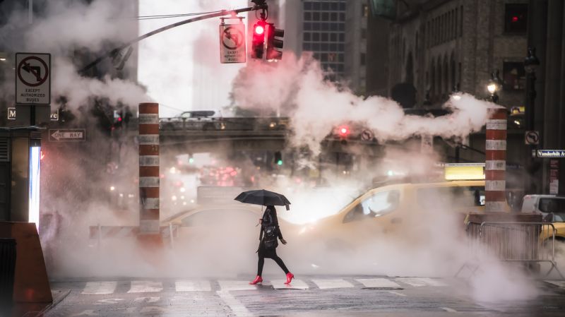 New York, USA, October 04, 2020. A woman wearing red high heels is crossing the 42nd street in Manhattan during the COVID-19 outbreak.