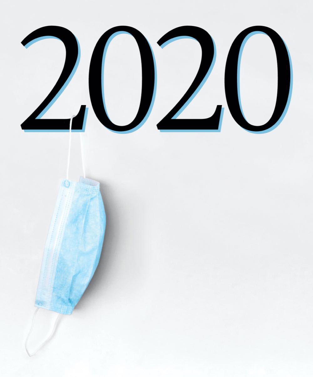 A mask hanging off of the numbers 2020