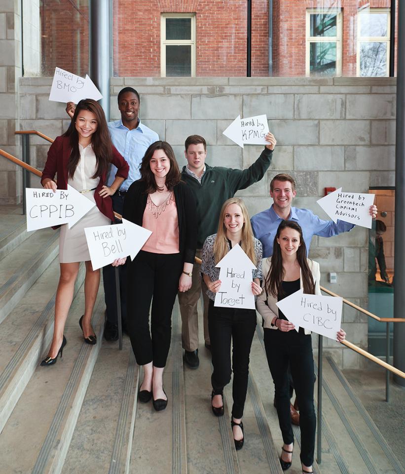 students with their new jobs written on paper