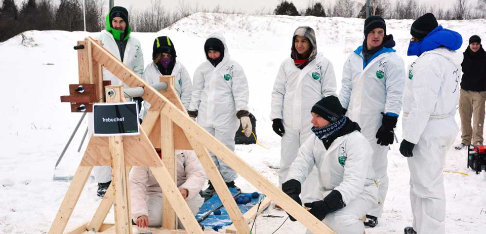 A Smith MBA team tackles the trebuchet challenge, an exercise in operating a replica of a siege engine used in the Middle Ages. 