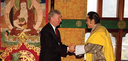 His Majesty Druk Gyalpo Jigme Khesar Namgyal Wangchuck, Mang-pos Bhur-ba’i rgyalpo, King of Bhutan (right) greets Stewart Beck after accepting his diplomatic credentials