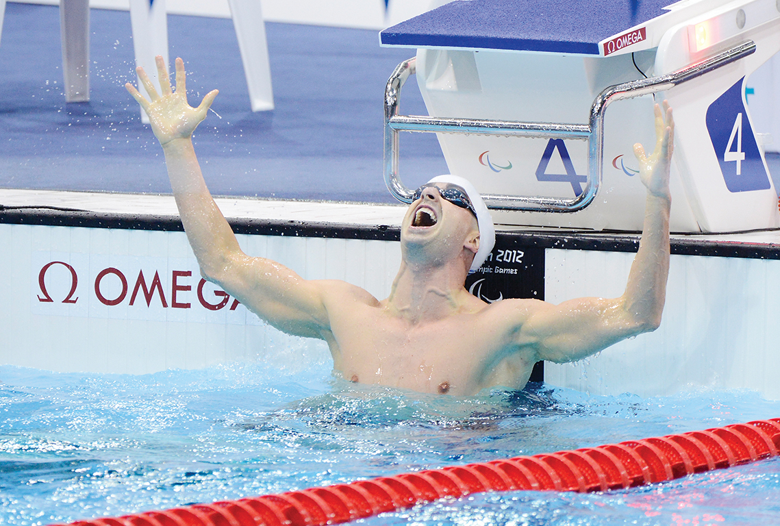 Ben Huot celebrates after swim race