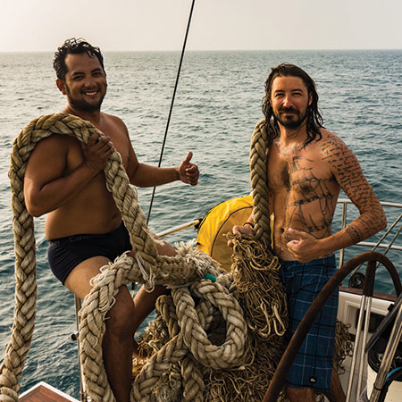 Russ Rowlands (right) at sea with a fellow crewmate