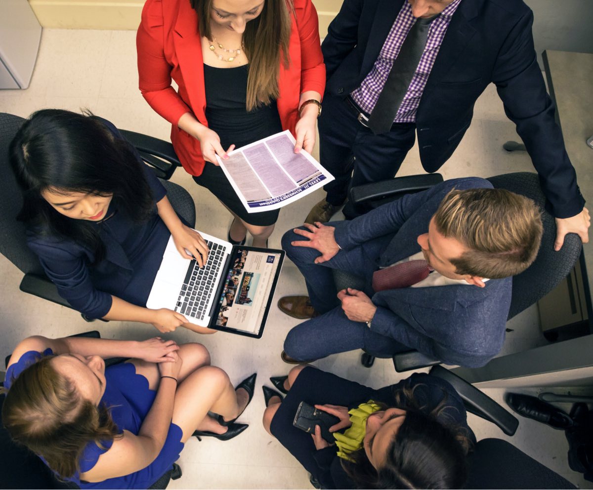 Students brainstorming in a boardroom