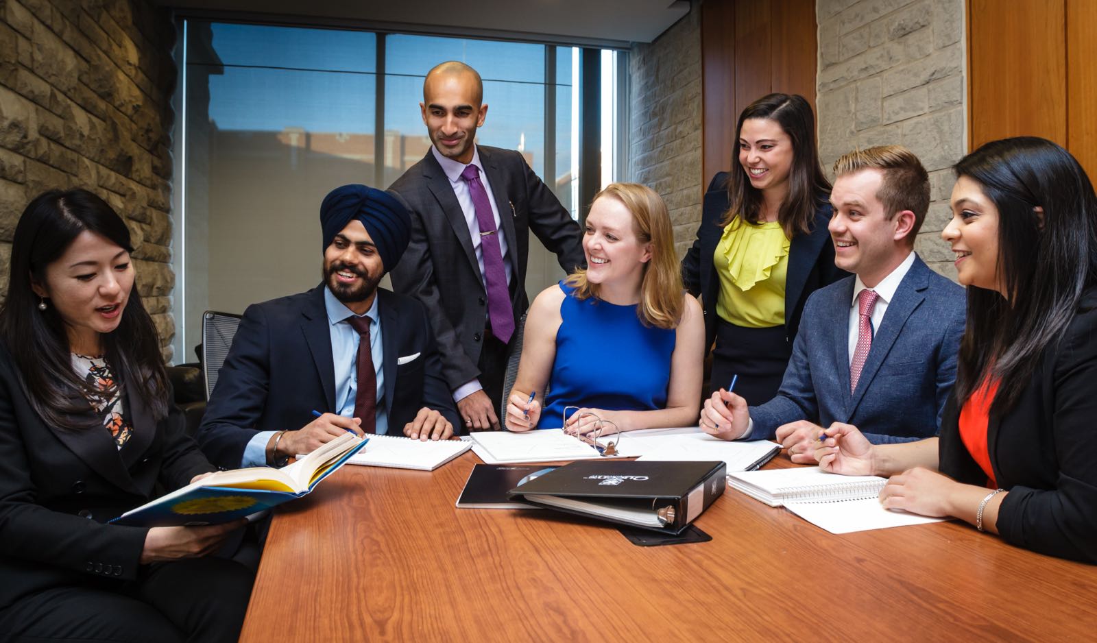 An MBA team working in a boardroom