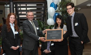 Students from Queen’s Graduate Diploma in Accounting present Rod Barr, FCA, President and CEO of the Institute of Chartered Accountants (ICAO), with a plaque honouring the university’s relationship with the Institute, which began in 1919, at an event to celebrate ICAO’s $2 million donation to Queen’s School of Business.