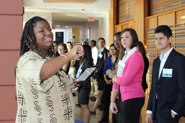 Utcha Sawyers, FoodShare Toronto, leads students through the “Privilege Walk”
