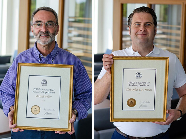 Michael Welker (left) and Christopher Miners with their Smith School of Business awards.