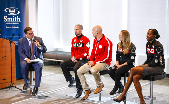 Arash Madani from Rogers Sportsnet with Olympic athletes at the Smith-COC partnership launch on November 3.