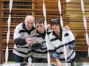 David McConomy, Ross Kelly (Comm’13) and Julie Carty shamelessly solicit donations to get sprung from jail.