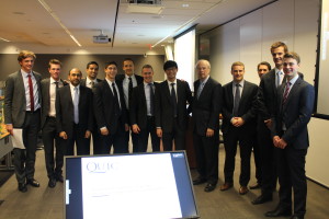 Pavi Binning, third from left, and Holger Kluge, fifth from right, with teams at the QUIC Analyst Deal Competition in Toronto