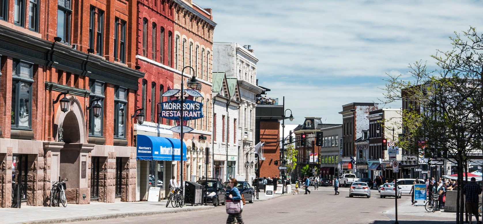 A steet view of downtown Kingston, featuring historic limestone buildings