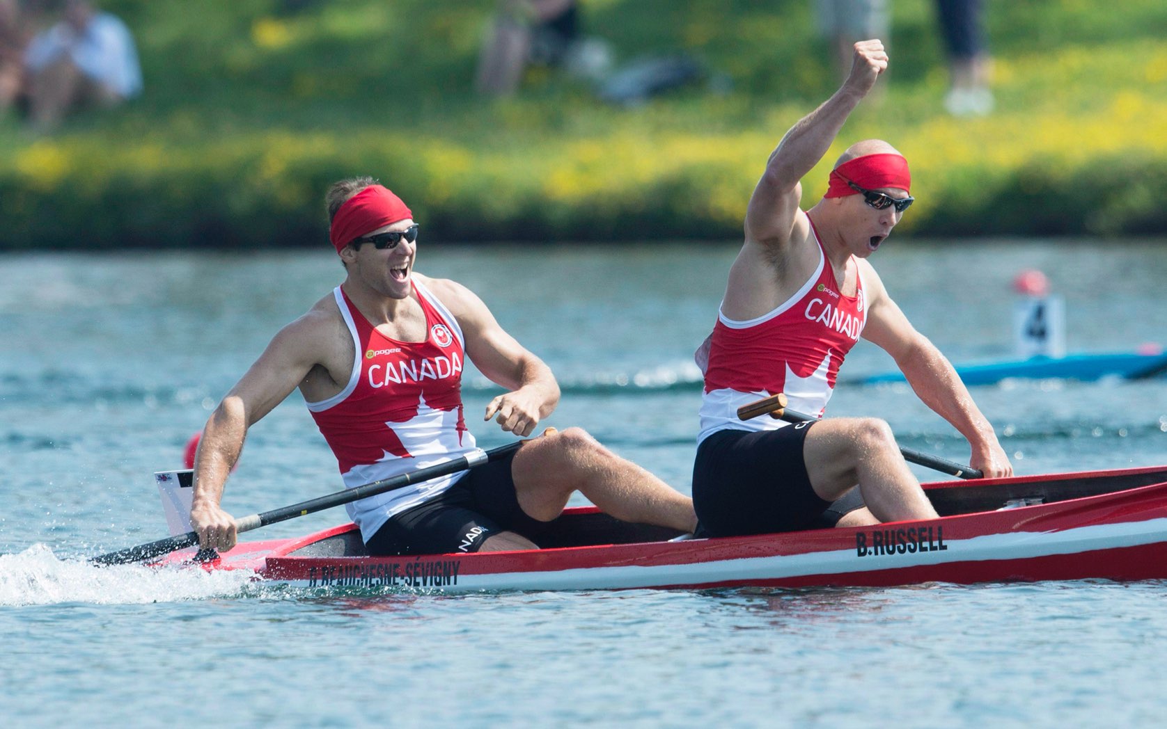 Gabriel Beauchesne-Sévigny and Ben Russell celebrating in their canoe